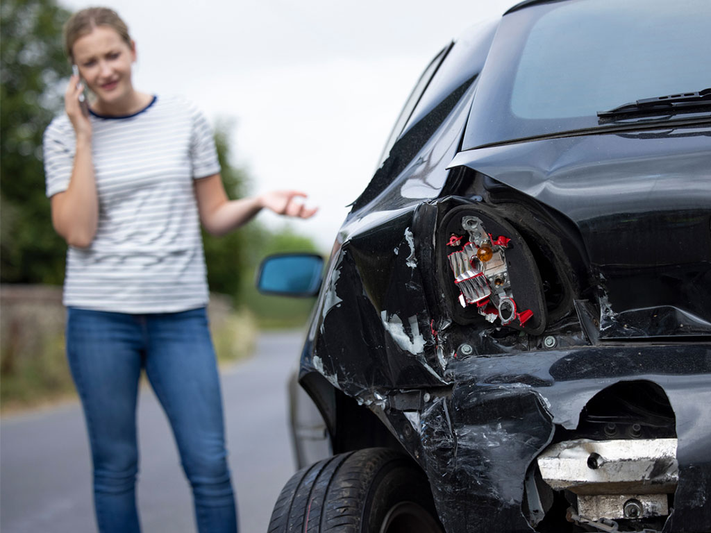 woman calling personal injury lawyer after car accident