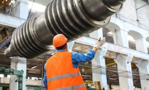 construction worker working on metal piping at jobsite