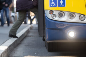 man getting on a bus