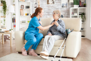 nurse taking nursing home patient’s heartbeat