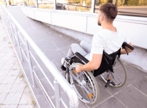 young man on wheelchair ramp